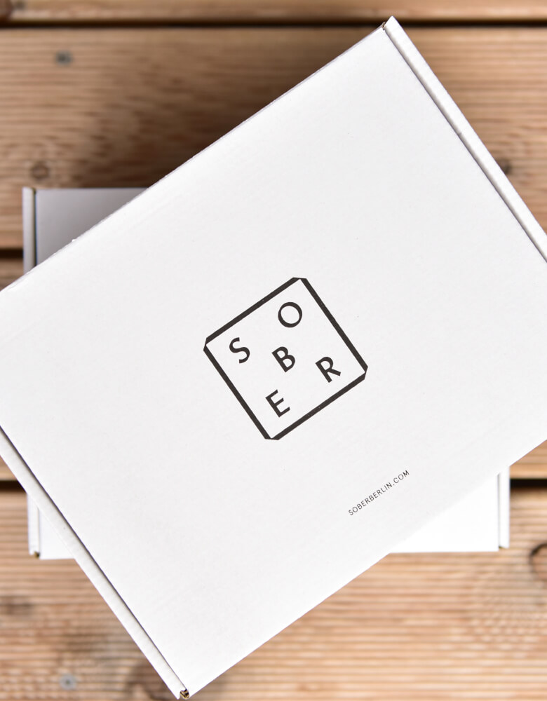 white mailer box printed with Sober logo